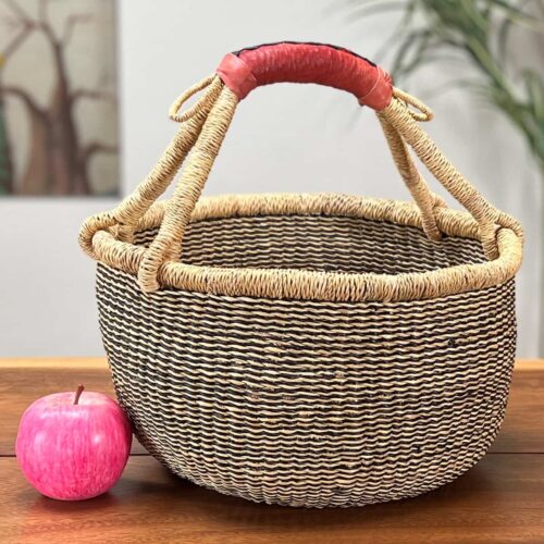 Medium Round African Market Basket next to an apple