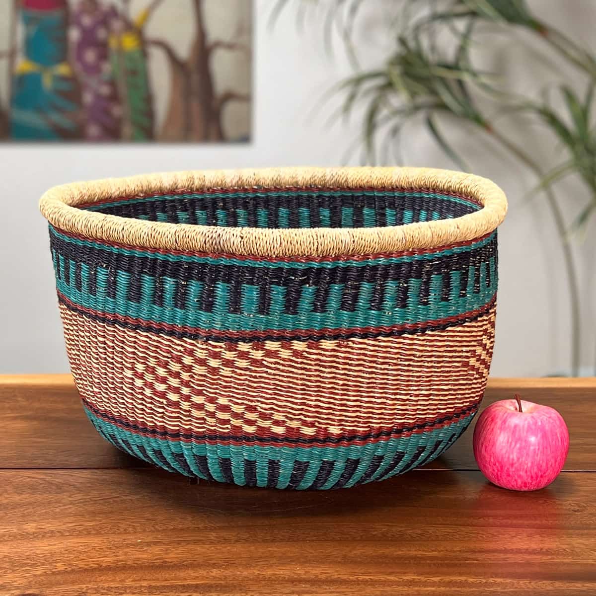 Round Basket without a handle next to an apple