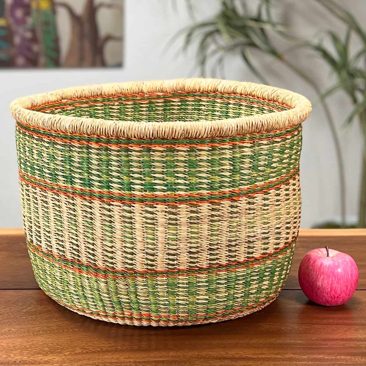 Round Basket without a handle next to an apple